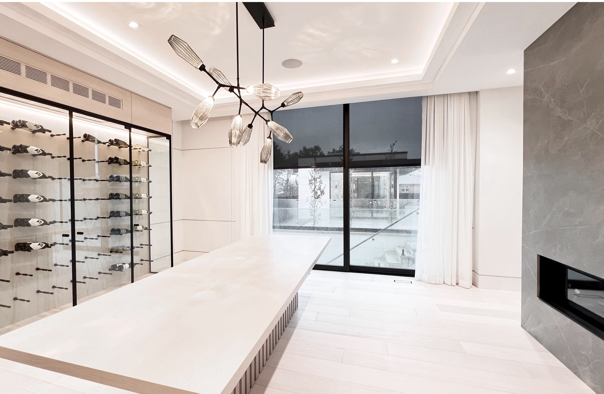 Roller shades and white sheers in a contemporary interior